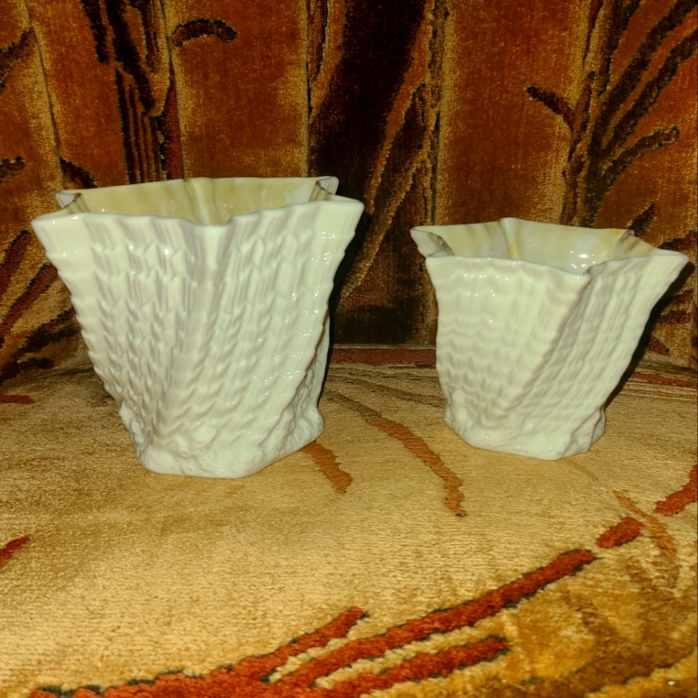 A vintage pair of Beleek twisted shell swirl vases....